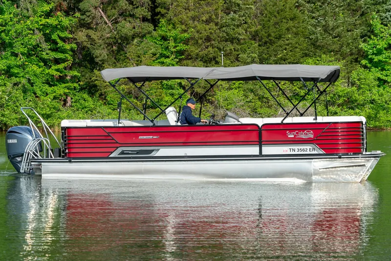 Slide: The Image of 2021 G3 SunCatcher Elite 326 Cruise pontoon boat on a serene lake. - 4