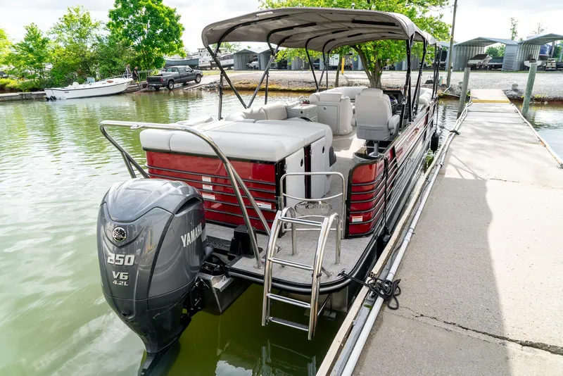 Slide: The Image of 2021 G3 SunCatcher Elite 326 Cruise pontoon boat docked with Yamaha 250 V6 engine. - 7