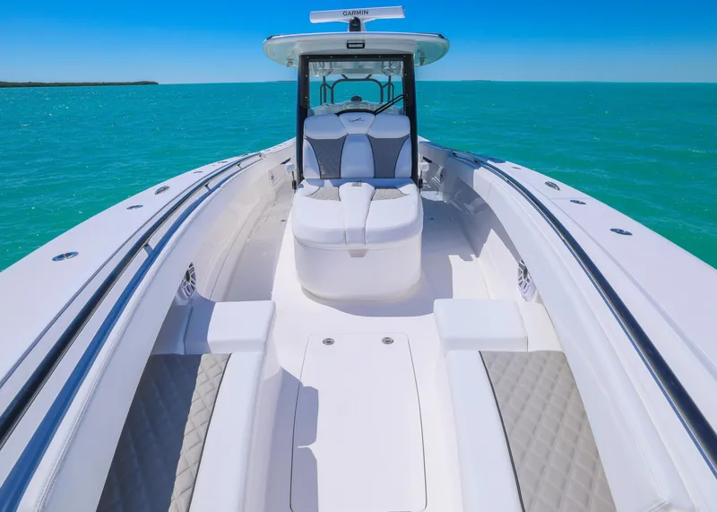 Slide: The Image of 2025 Blackwater 43 Sportfish boat on turquoise water, featuring sleek design and spacious deck. - 10