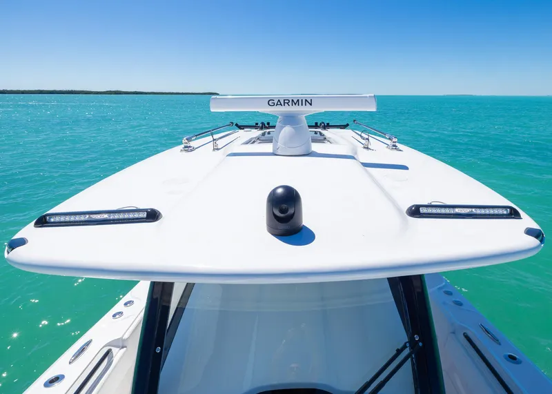 Slide: The Image of 2025 Blackwater 43 Sportfish boat with Garmin equipment on turquoise water. - 14