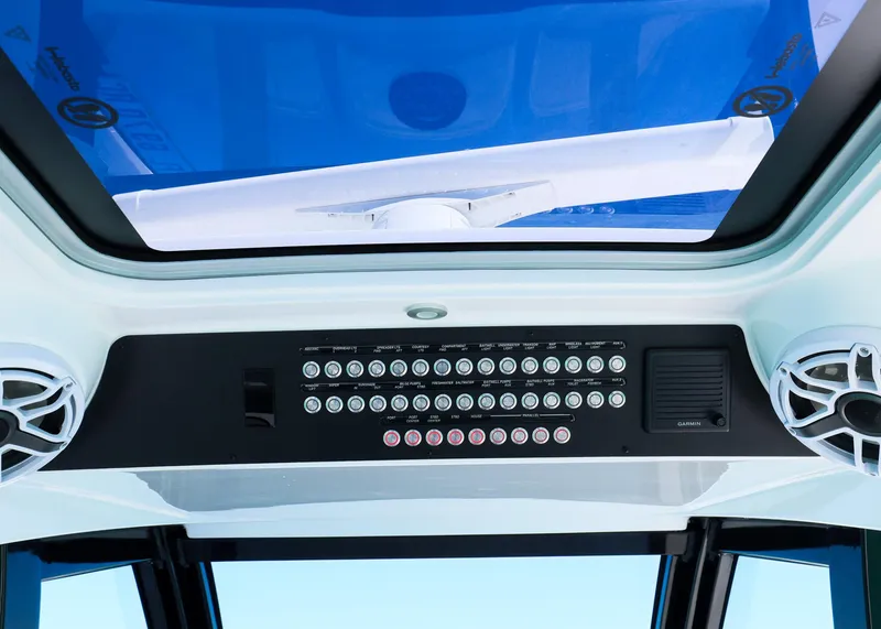 Slide: The Image of Control panel of 2025 Blackwater 43 Sportfish boat with blue-tinted roof. - 15