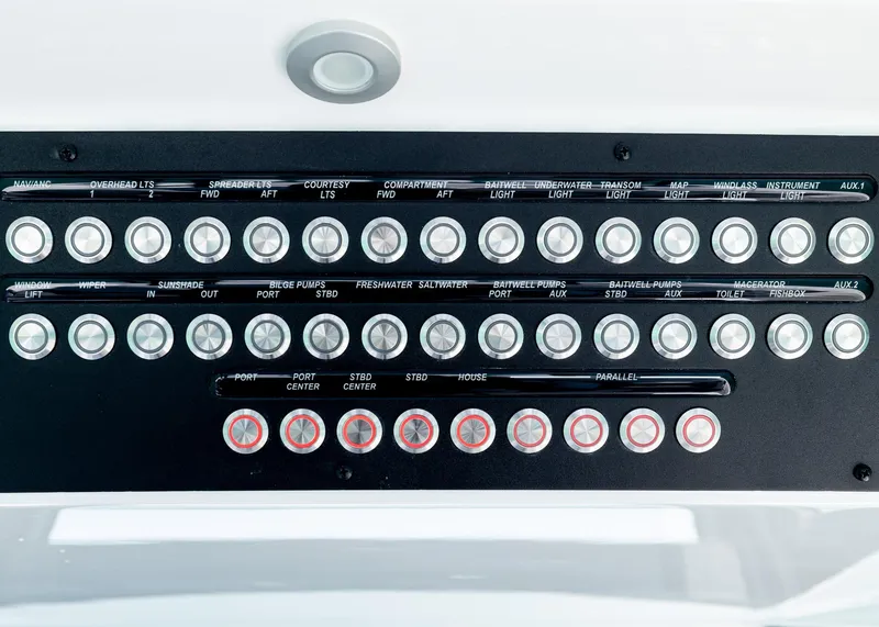 Slide: The Image of Control panel of a 2025 Blackwater 43 Sportfish boat with labeled buttons and switches. - 16