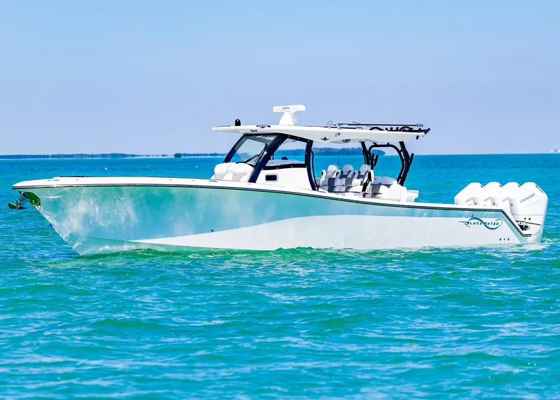 Slide: The Image of 2025 Blackwater 43 Sportfish boat cruising on clear blue water. - 2