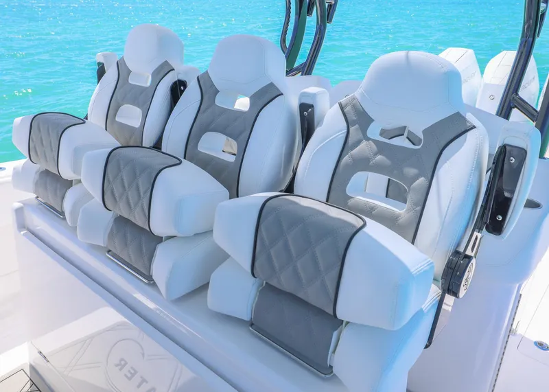 Slide: The Image of Luxurious seating on 2025 Blackwater 43 Sportfish boat against clear blue water. - 22