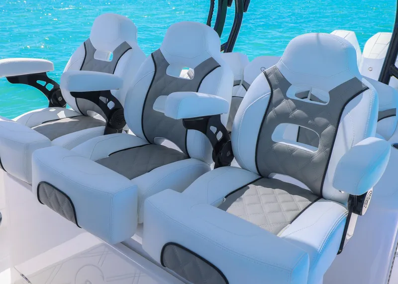 Slide: The Image of Luxurious seating on 2025 Blackwater 43 Sportfish boat against clear blue water. - 23