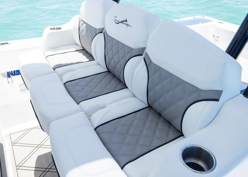 Slide: The Image of Luxurious seating on 2025 Blackwater 43 Sportfish boat with quilted upholstery and cup holder. - 25