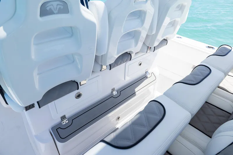 Slide: The Image of Luxury seating on 2025 Blackwater 43 Sportfish boat, featuring white and gray cushioned design. - 26