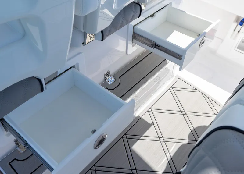 Slide: The Image of Open storage drawers on a 2025 Blackwater 43 Sportfish boat, showcasing interior design. - 28