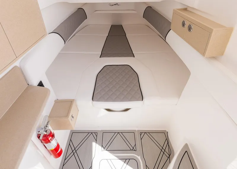Slide: The Image of Interior of 2025 Blackwater 43 Sportfish boat with cushioned seating and fire extinguisher. - 41