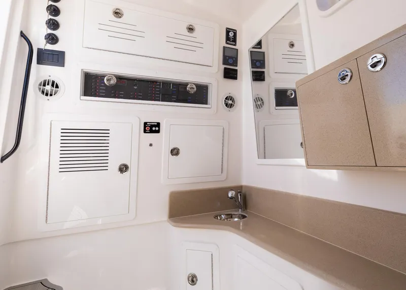 Slide: The Image of 2025 Blackwater 43 Sportfish interior with control panels and storage cabinets. - 43