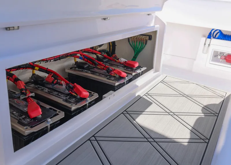 Slide: The Image of Battery compartment of 2025 Blackwater 43 Sportfish boat, showcasing organized wiring and modern design. - 45