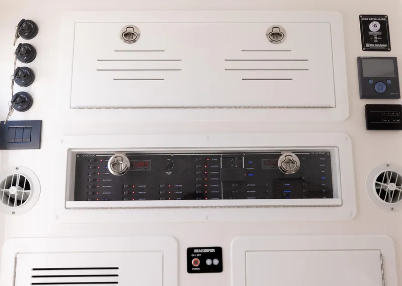 Slide: The Image of Control panel of 2025 Blackwater 43 Sportfish boat, featuring switches and gauges. - 47