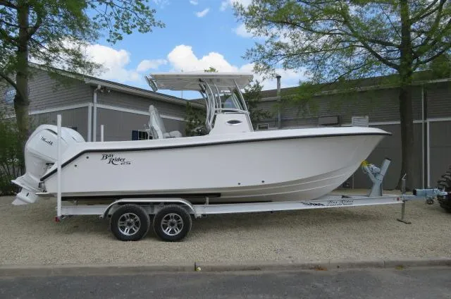 The Image of 2025 KenCraft 25 Offshore boat on trailer, parked outdoors near building. - 0