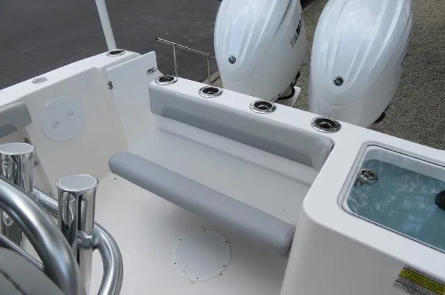 Slide: The Image of 2025 KenCraft 25 Offshore boat with dual engines and seating area. - 11