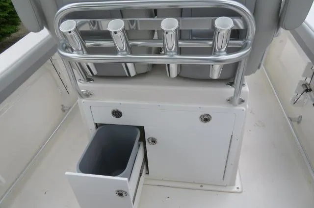 Slide: The Image of 2025 KenCraft 25 Offshore boat interior with rod holders and storage compartment. - 20