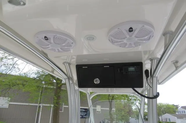 Slide: The Image of 2025 KenCraft 25 Offshore boat interior with speakers and control panel. - 25