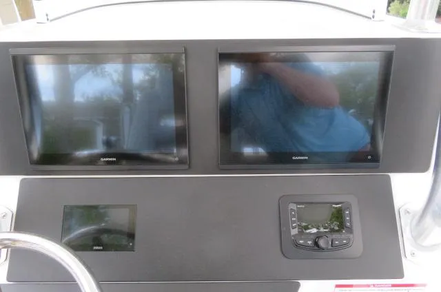 Slide: The Image of Control panel of 2025 KenCraft 25 Offshore boat with dual Garmin displays. - 28