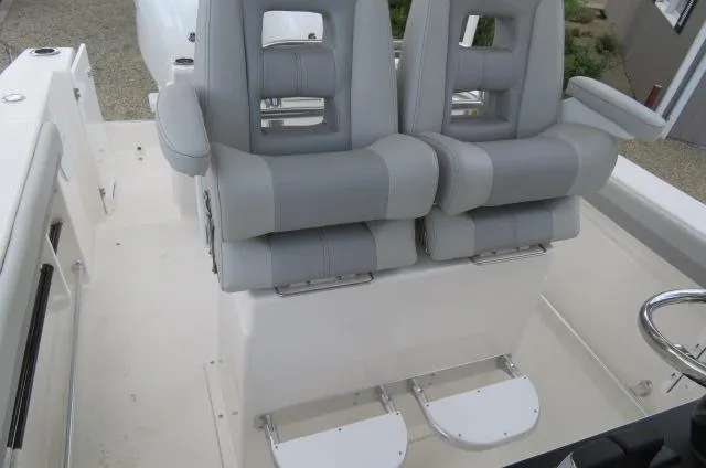 Slide: The Image of 2025 KenCraft 25 Offshore boat with dual gray cushioned seats. - 30