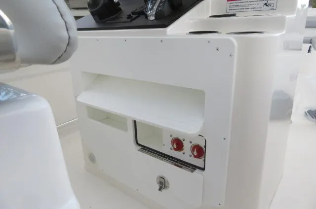Slide: The Image of KenCraft 25 Offshore 2025 boat console with storage and control panel. - 31