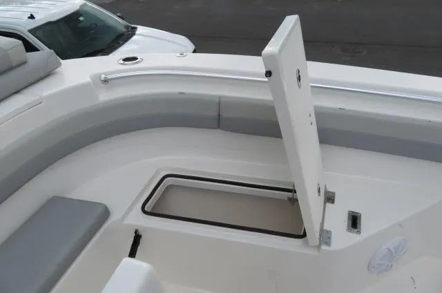 Slide: The Image of 2025 KenCraft 25 Offshore boat with open storage compartment on deck. - 41