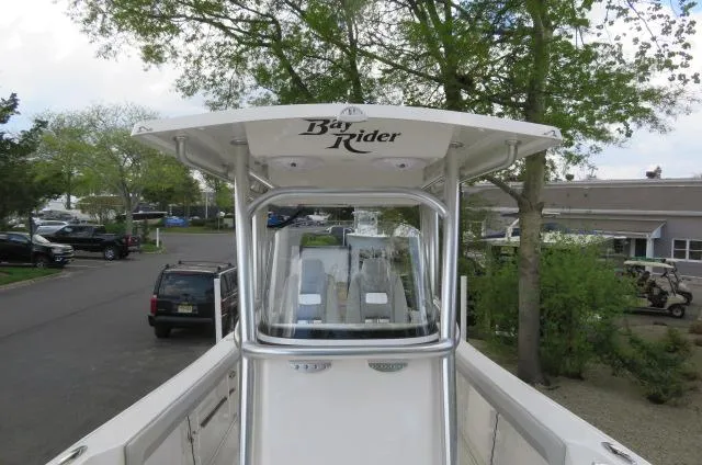 Slide: The Image of 2025 KenCraft 25 Offshore boat with "Bay Rider" canopy, parked outdoors. - 42