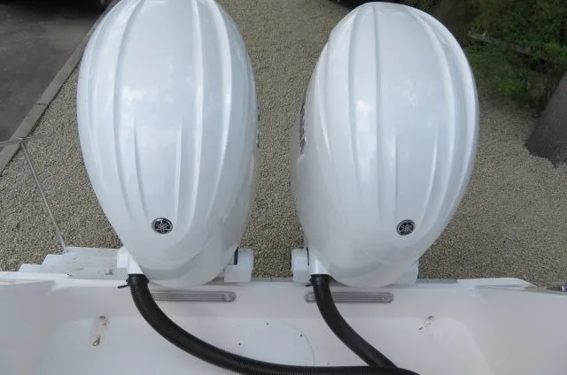 Slide: The Image of Twin outboard motors on a 2025 KenCraft 25 Offshore boat, viewed from above. - 7