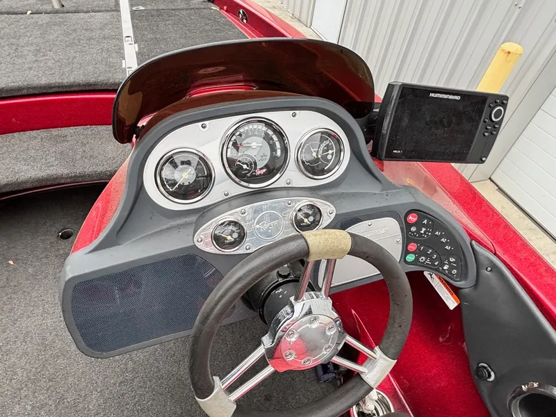 Slide: The Image of 2005 Ranger Z20 Comanche boat dashboard with steering wheel and gauges. - 6
