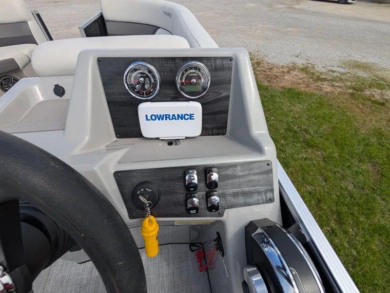 Slide: The Image of Control panel of 2022 Harris Cruiser 210 boat with Lowrance display and gauges. - 17