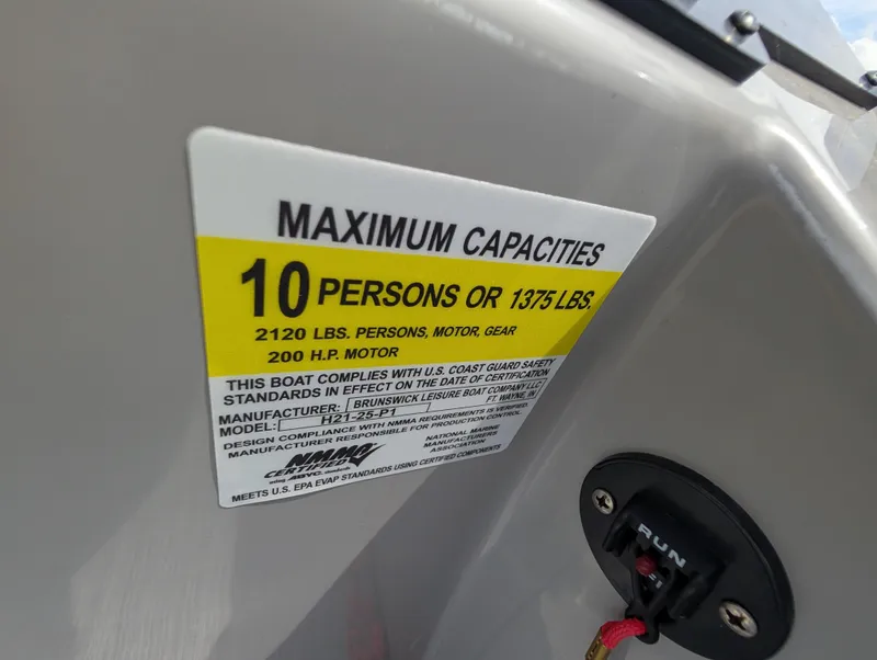 Slide: The Image of 2022 Harris Cruiser 210 capacity label: 10 persons or 1375 lbs, 200 HP motor. - 18