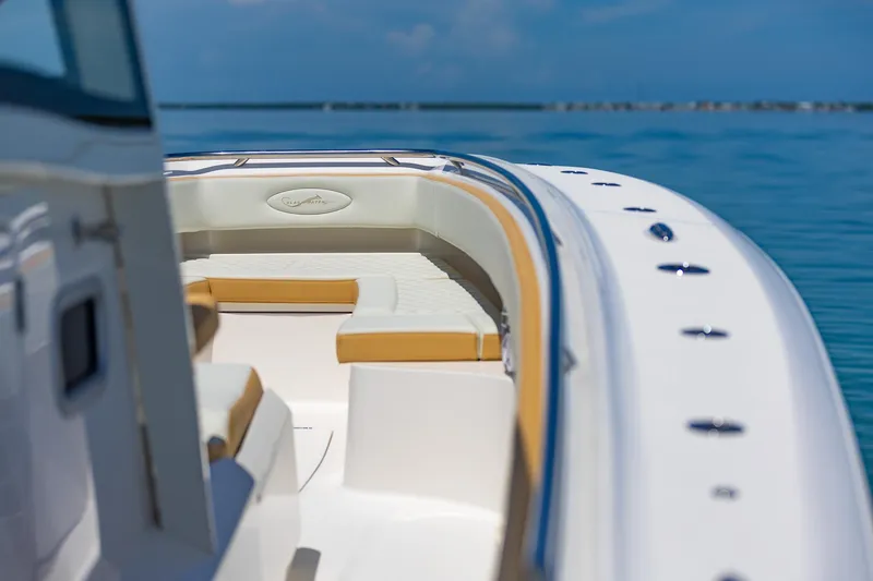 Slide: The Image of 2024 Blackwater 43 Sportfish boat with luxurious seating on calm blue waters. - 17