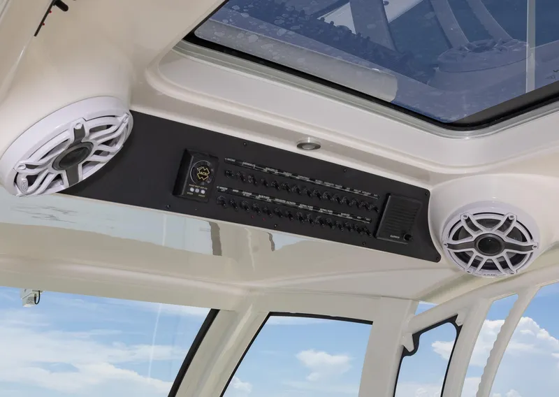 Slide: The Image of 2024 Blackwater 43 Sportfish interior with speakers and control panel under skylight. - 29