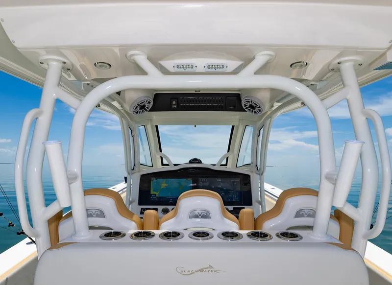 Slide: The Image of 2024 Blackwater 43 Sportfish helm with advanced navigation system and ocean view. - 30