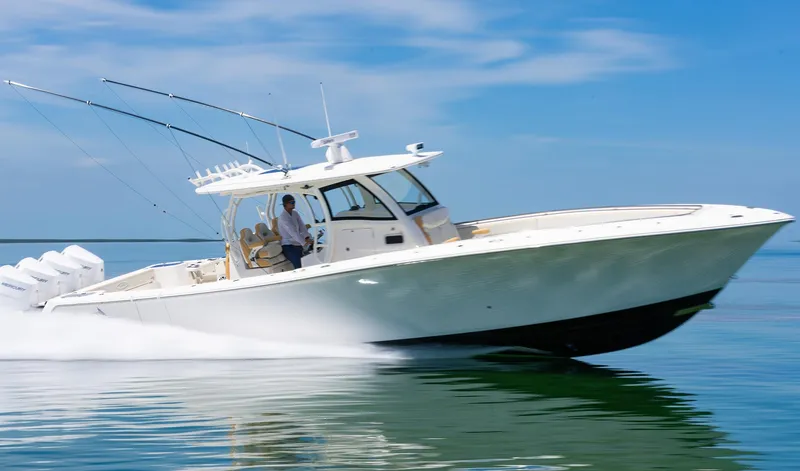 Slide: The Image of 2024 Blackwater 43 Sportfish boat cruising on calm water under a clear blue sky. - 4