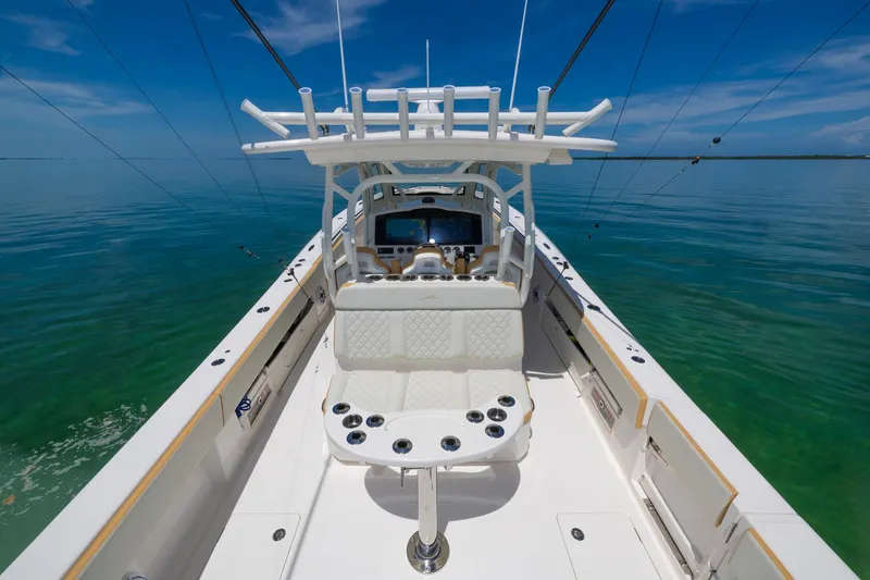 Slide: The Image of 2024 Blackwater 43 Sportfish boat, spacious deck, rod holders, clear blue sea background. - 43