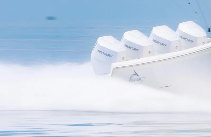 Slide: The Image of 2024 Blackwater 43 Sportfish boat with four Mercury engines speeding on water. - 7