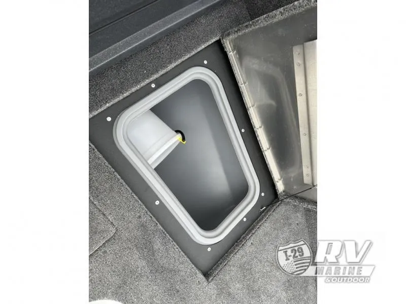 Slide: The Image of 2025 Tracker Pro Guide V-175 WT boat storage compartment with carpeted interior. - 21