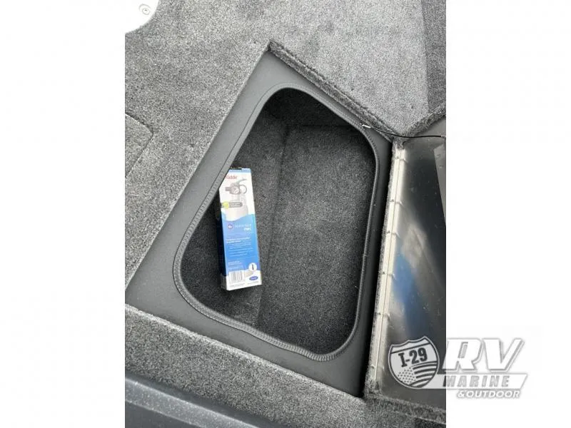 Slide: The Image of 2025 Tracker Pro Guide V-175 WT storage compartment with a packaged item inside. - 22