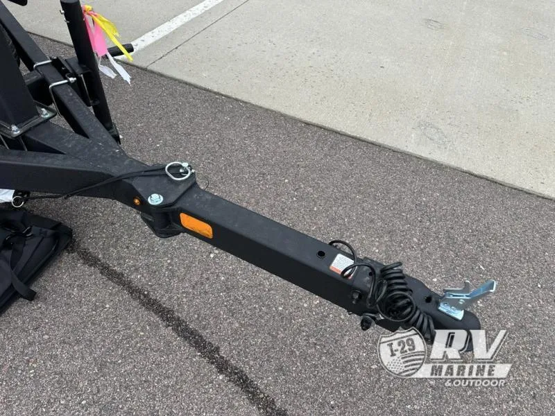 Slide: The Image of Trailer hitch of 2025 Tracker Pro Guide V-175 WT on asphalt surface. - 27