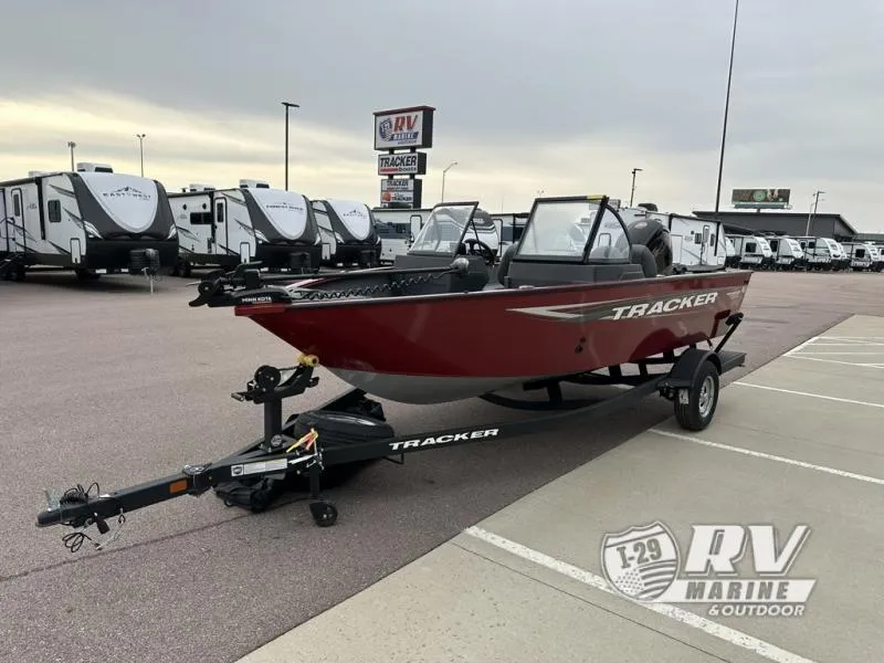 Slide: The Image of 2025 Tracker Pro Guide V-175 WT boat on trailer at RV Marine dealership. - 4