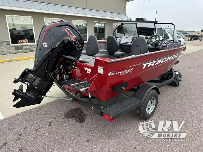 Slide: The Image of 2025 Tracker Pro Guide V-175 WT boat, red, on trailer, outside RV Marine & Outdoor store. - 6