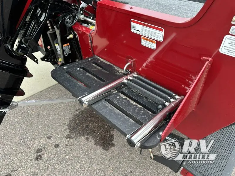 Slide: The Image of 2025 Tracker Pro Guide V-175 WT boat with rear ladder and red exterior. - 9