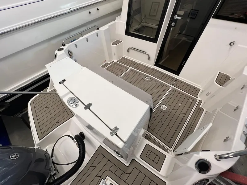 Slide: The Image of 2022 Cutwater C-24 Coupe boat interior with teak flooring and modern design. - 34
