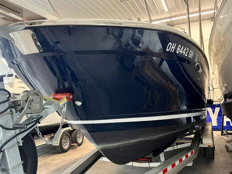 Slide: The Image of 2022 Cutwater C-24 Coupe boat on trailer in indoor storage. - 36