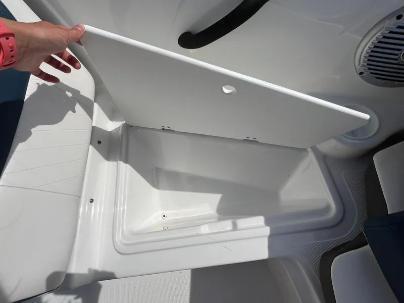 Slide: The Image of Open storage compartment on 2023 Tahoe 185 S boat. - 11