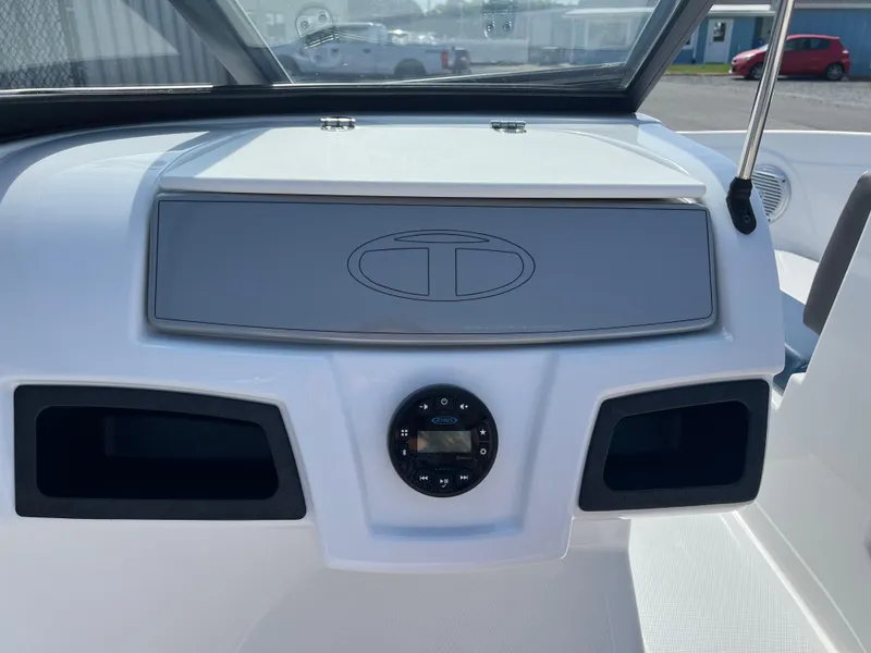 Slide: The Image of Dashboard of 2023 Tahoe 185 S boat with control panel and storage compartments. - 12