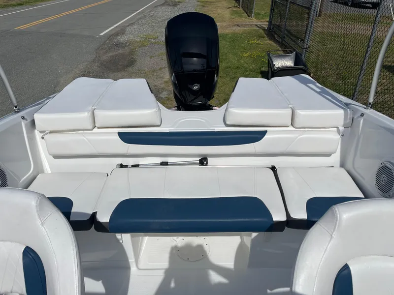 Slide: The Image of 2023 Tahoe 185 S boat interior with white and blue seating. - 3