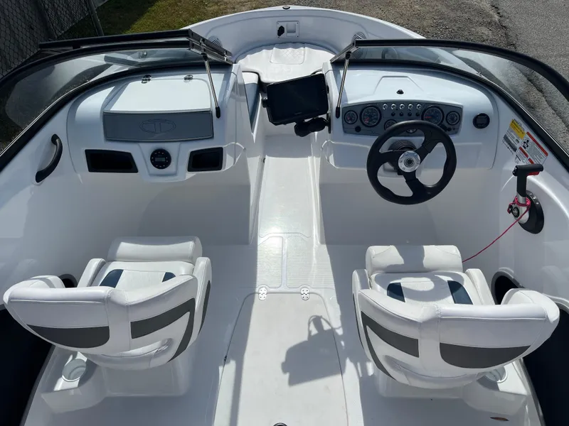 Slide: The Image of 2023 Tahoe 185 S boat interior with dual seats and modern dashboard. - 4