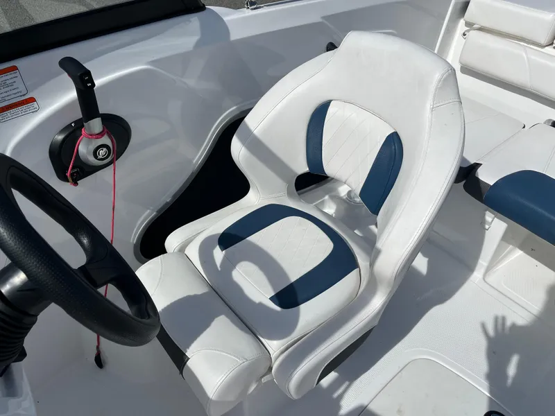 Slide: The Image of 2023 Tahoe 185 S boat interior with white and blue seating. - 7