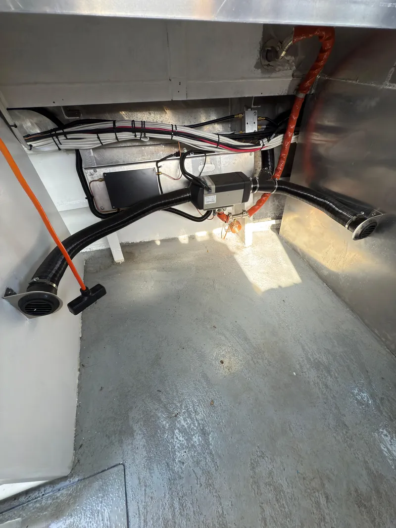 Slide: The Image of Interior view of a 1975 Monark 30 Fishing Boat, showcasing wiring and components. - 12