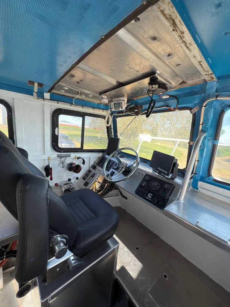 Slide: The Image of 1975 Monark 30 Fishing Boat interior with steering wheel and navigation equipment. - 22